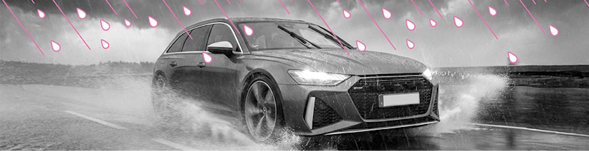 Auto fährt bei starkem Regen auf nasser Straße